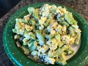 A completed plate of Chinese Bitter Melon Scrambled Eggs with Mushroom