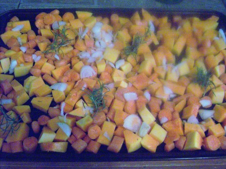 Chopped vegetables on a roasting pan.