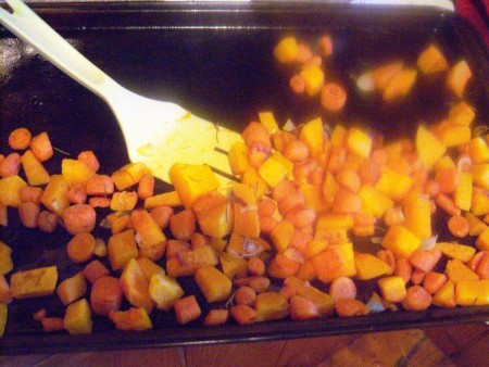 Chopped vegetables on a roasting pan.