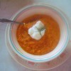 A bowl of butternut squash and carrot soup.