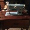 A blue vintage sewing machine.