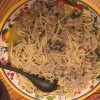 A serving dish of the mushroom spinach and sausage pasta.