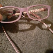 A pair of pink eyeglasses.