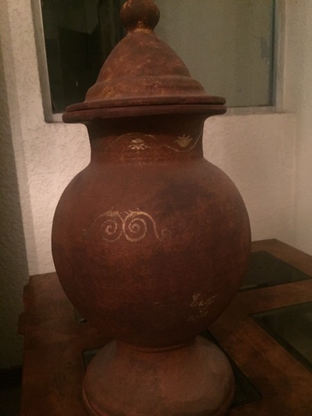 A decorative jar with a pointed lid.