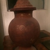 A decorative jar with a pointed lid.