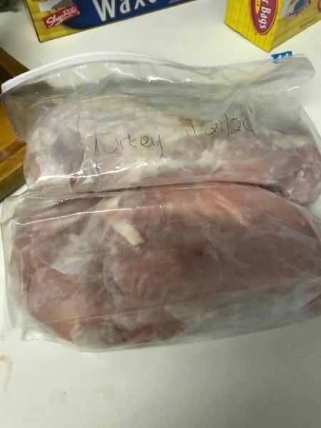A bag filled with turkey parts, for the freezer.