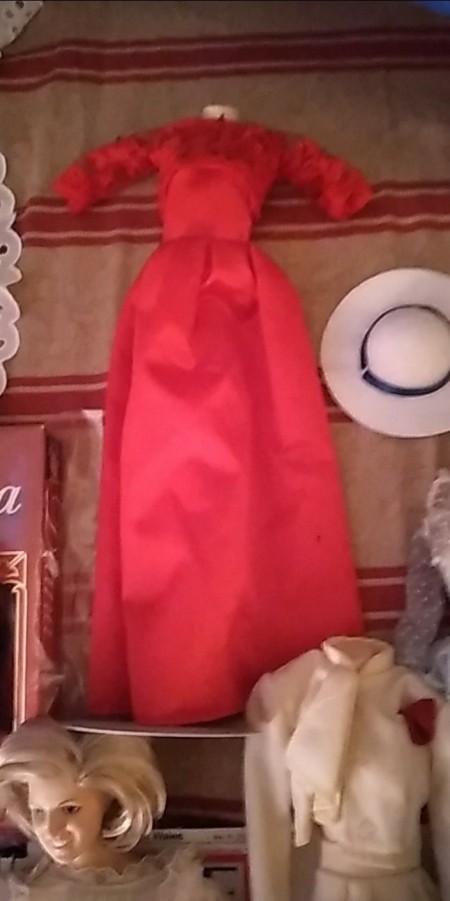 A red doll dress with hat.