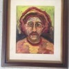 A painting of man in yellows, oranges, reds and browns.