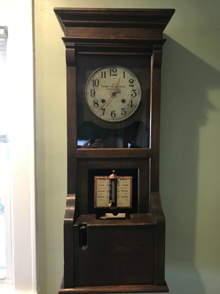 A grandfather clock style time punch clock.