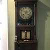 A grandfather clock style time punch clock.