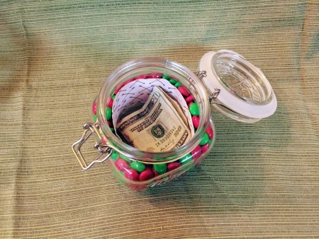 Money inside a candy jar.