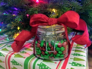 A candy jar with a red bow.