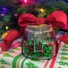 A candy jar with a red bow.
