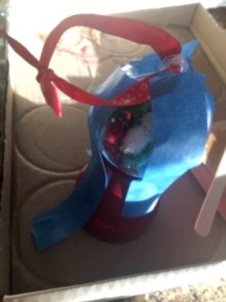 Mini Gumball Machine Christmas Ornament - threading ribbon through the ornament hanger, with the ball held in place with painter's tape until glue dries