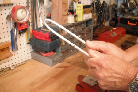 Bag Holder for Picking Up Litter - hand bending the handle