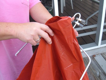 Bag Holder for Picking Up Litter - continuing the place bag on the holder