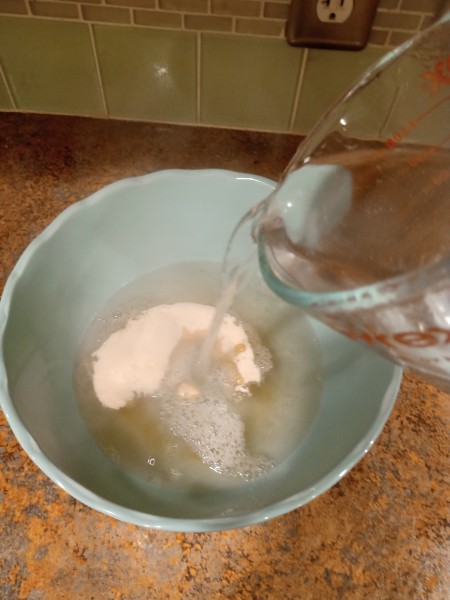 Soap Jellies - pouring water into the bowl with the dry gelatin