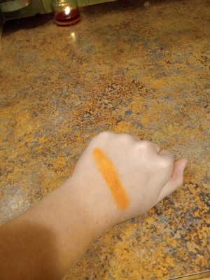 DIY Crayon Lipgloss - lipgloss on the back of her hand