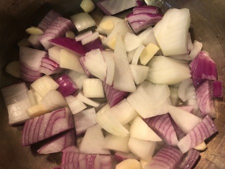 Chopped onions in a large pot.