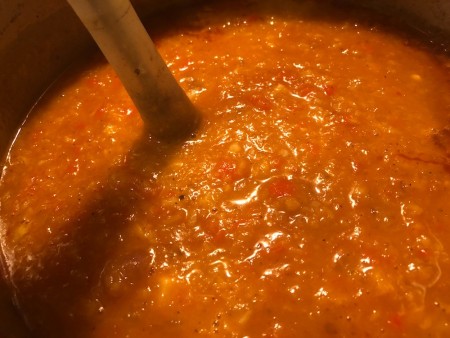 Using an immersion blender in a large soup pot.