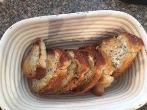 The finished loaf of sliced cheesy garlic bread.