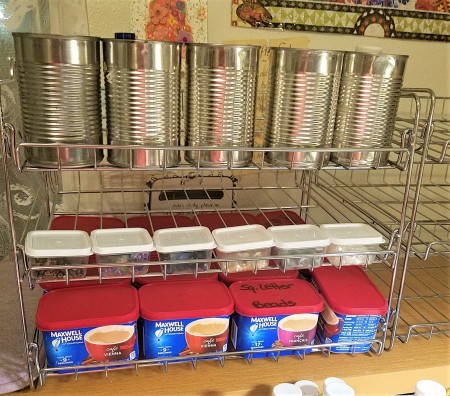 A can organizer being used for craft supplies.