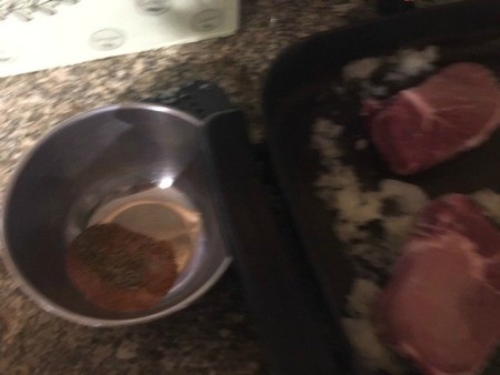 Cooking the pork chops in a pan.