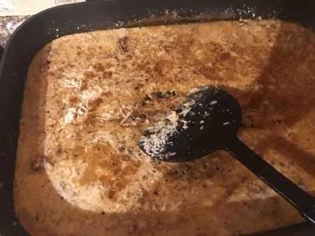 Mixing the gravy in the pan drippings.