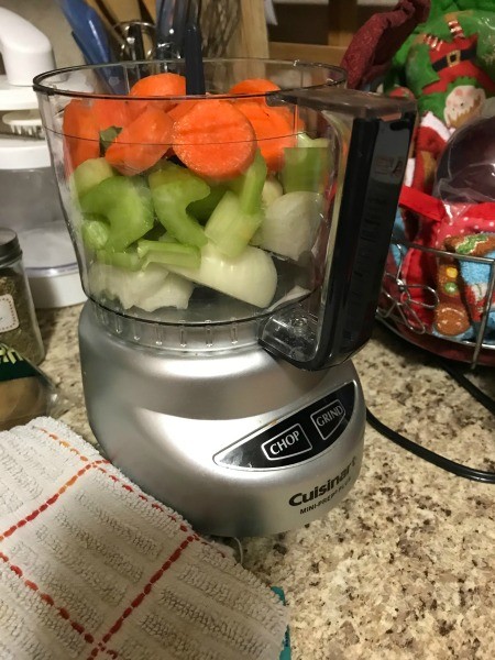 Using a food processor to finely chop the veggies.