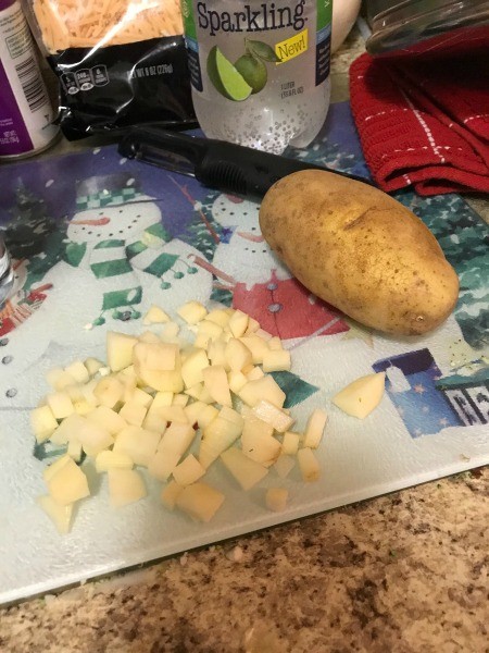 Chopping potatoes for the soup.