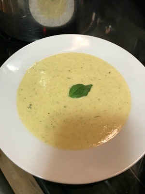 A bowl of broccoli cauliflower cheese soup.