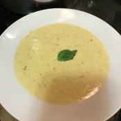 A bowl of broccoli cauliflower cheese soup.