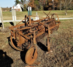 An old and rusted piece of farm equipment.