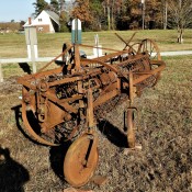 An old and rusted piece of farm equipment.