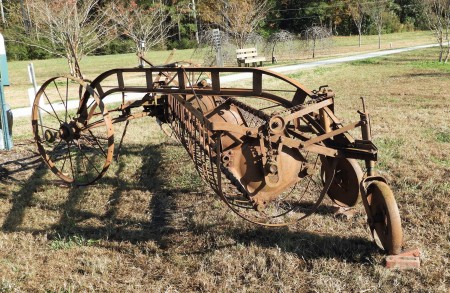 An old and rusted piece of farm equipment.