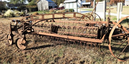 An old and rusted piece of farm equipment.