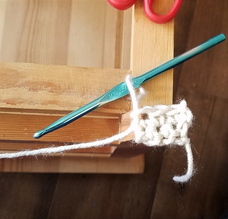 Converting a Drawer Unit Into a Footstool - beginning to crochet the booties