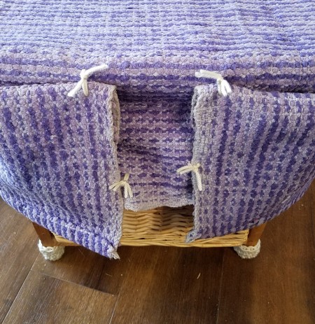 Converting a Drawer Unit Into a Footstool - view of the tied corners from the wrong side - with yarn ends trimmed