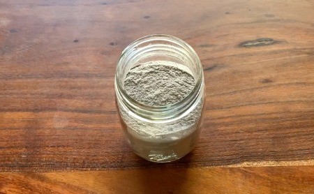 The hot chocolate mixture in a glass jar.