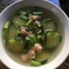 A bowl of cucumber shrimp soup.