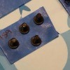 Keeping Track of Screws When Assembling a Treadmill - closeup of button head machine screws on blue painter's tape