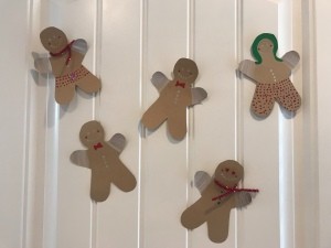 Colorful gingerbread people decorating a wall.