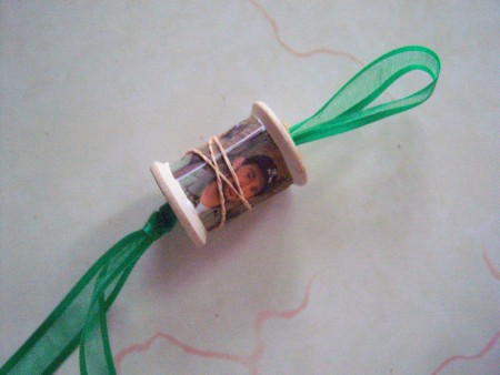 Rubber bands holding the picture in place while the glue dries.