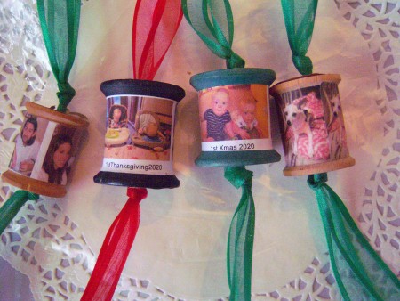 Four finished spool ornaments.
