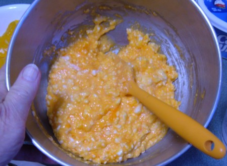 Mixing the ingredients together in a bowl.