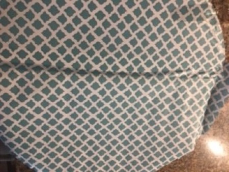 Removing the covering from an old table.