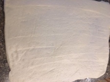 A large square of dough.