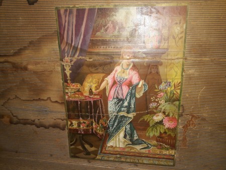A picture on an antique trunk.