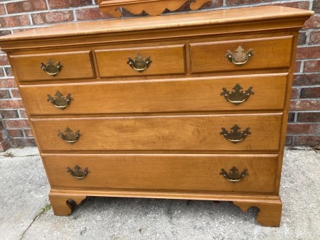 A wooden dresser wth drawers.