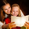 A mother and daughter reading a poem at Christmas time.